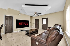 103" 4k laser projection screen to enjoy all of your films and shows on.