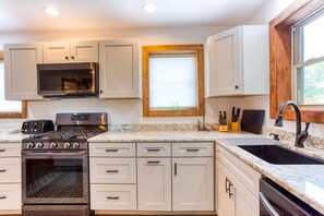 Another view of the kitchen with high end appliances