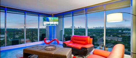 Living Room Evening Time With Blue LED Lighting And Beautiful Scenic Ocean Views