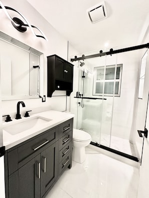 This bathroom was just remodeled with a new vanity and stone top counter.