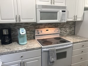 Fully stocked kitchen with Keurig and regular coffee pot