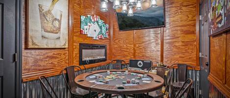 Chill in the card room and play some Texas hold 'em and watch the game...