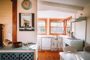 The kitchen and dining area are bathed in natural light throughout the day, creating a warm and inviting space.