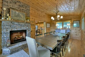 Dining room. Enjoy the warmth from the fireplace while you gathering. 