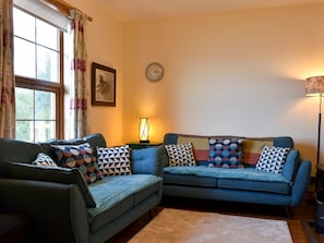 Cosy living room with open fire | The Creagan, Corrie, near Brodick