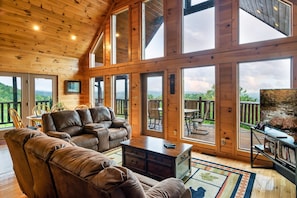 Main level 2nd floor living room and its wall of windows