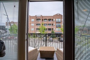 One of two balconies on the main floor faces Harrison Street to the south.