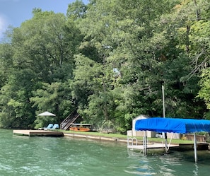 Over 105' of private shoreline, large yard, two docks, kayak and paddle board
