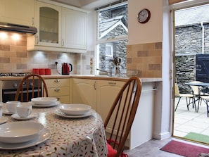 Well equipped kitchen/diner with access to the garden | Squirrel Cottage, Windermere