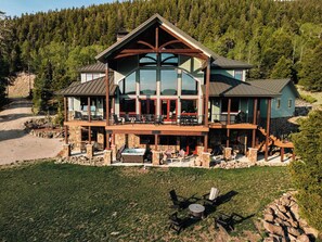 Back of house with views of meadows and sunsets.