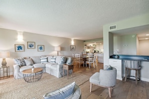 Open floor plan from the balcony, to the family room, to the dining area and into the kitchen.