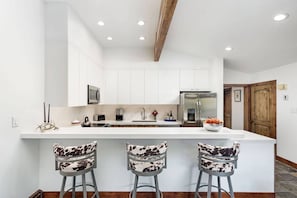 The completely new kitchen is fully stocked for your cooking and dining pleasure while vacationing here.