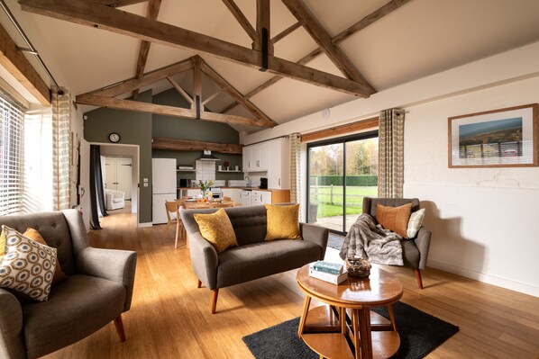 Tern Cottage living space overlooking terrace and gardens