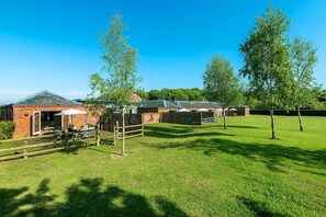 Shared gated gardens at Cranmer Country Cottages