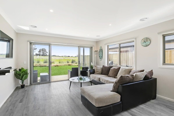 beautiful light filled living area with beautiful rural views 