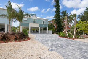 Private paved drive way with ample parking for cars, trucks and trailers