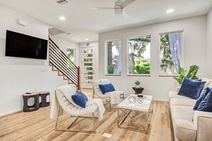 Living room space - High ceilings, Queen sofa bed.