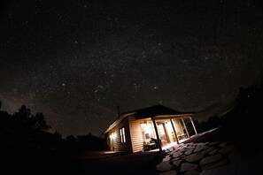 Milky Way is seen above the cabin.