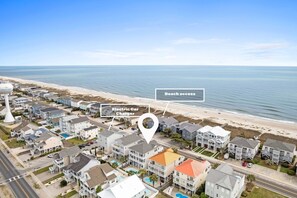 Located across from ramp/beach mat access; EV charger location 