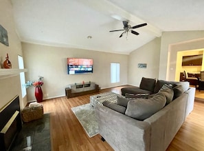 Spacious family room with a 65 inch smart TV 