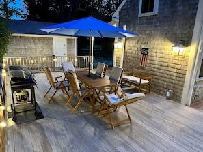 Soft lighting sets the mood at night on the deck - 98 West Road Orleans Cape Cod New England Vacation Rentals