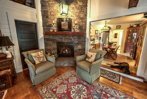 The Great Room off the original kitchen, with gas fireplace and stone mantel.