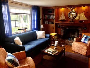 The Ship's (Room)Living. Decorated in a tasteful nautical theme with fireplace