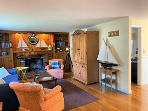 The Ship's (Room)Living. Decorated in a tasteful nautical theme with fireplace