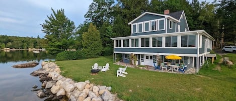 The view of the house and private garden from the lake