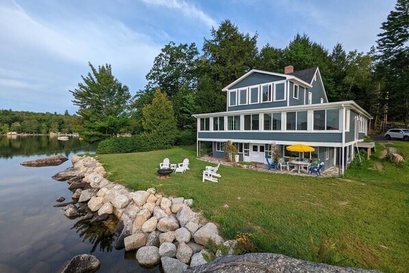 The view of the house and private garden from the lake