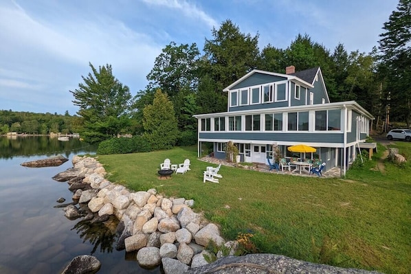 The view of the house and private garden from the lake