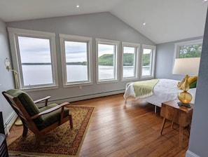 Relax while enjoying the stunning lake views from the master bedroom