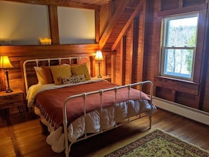 Bedroom #2 with lake views, a spacious built-in closet and a queen size bed.