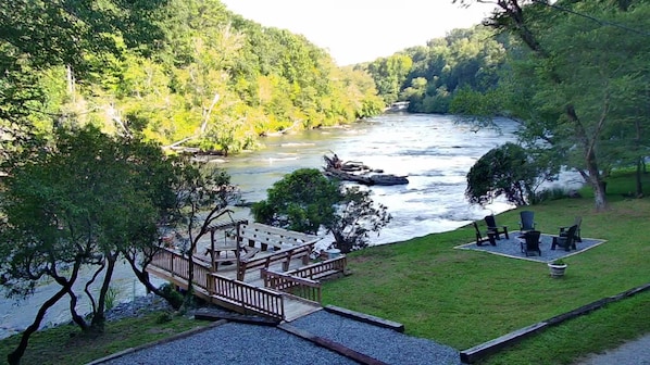 Front yard with deck on the river.