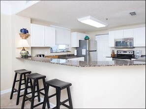 Modern kitchen with stainless steel appliances