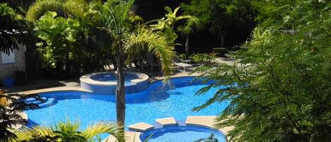 Enjoy pools on site surrounded by greenery