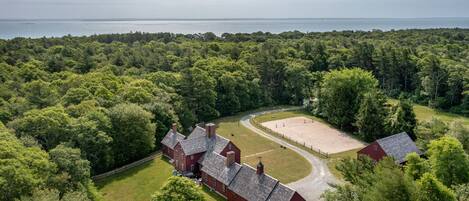 Aerial view of home, barn, property and beach/ocean walking distance
