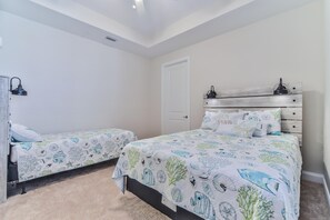 2nd bedroom with queen bed and twin