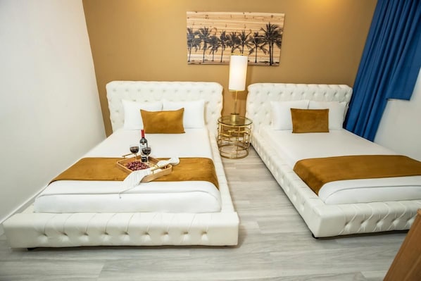 Bedroom with a King size bed. The exact unit will be assigned upon arrival. Views, colors, and decor may vary