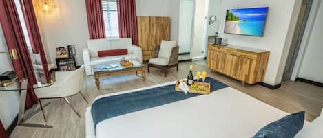 Bedroom with King size bed and a flat-screen TV. The exact unit will be assigned upon arrival. Views, colors, and decor may vary