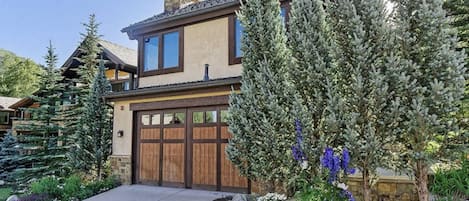 There is space in the garage for one vehicle and another can be parked in the drive in front of the garage doors.