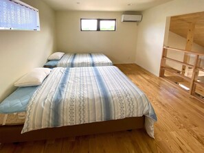 ・ EAST Bedroom: A well-ventilated room on the second floor. It is a semi-double bed made of France Bed