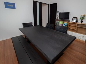 Shared dining room and hangout. Common Living / Dining Room w / Fridge, Waching Machine, Microwave, Hot-Water