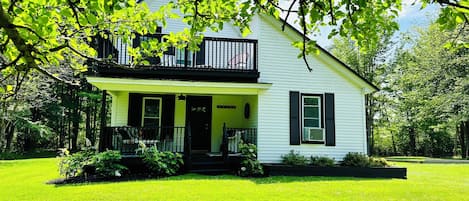 Double front porch side of cottage