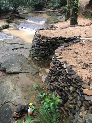 stacked stone walls by the creek