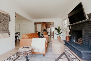 Living room with leather couch and smart tv