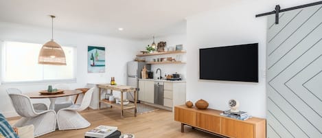 Open living area with Smart TV, Kitchenette and dining room.  