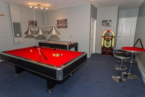 Games room feature pool table and air hockey