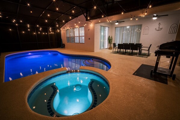 Stunning Pool with Nighttime Illumination and Relaxing Hot Tub.