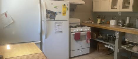 Full use of Community Kitchen includes a stove with oven and dishes/utensils.